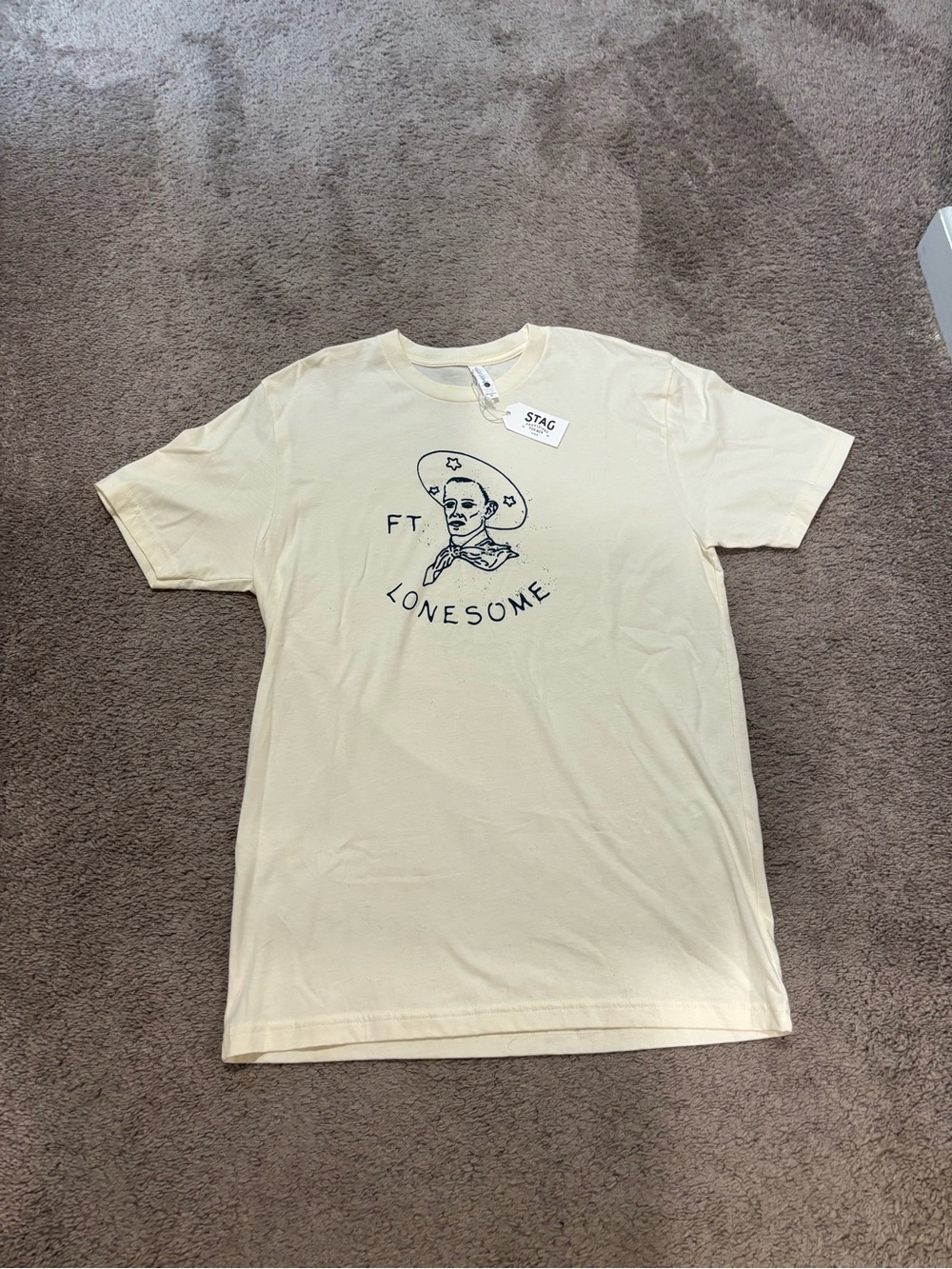 Men’s Off White Short Sleeve Stag Men’s Provision Ft Lonesome Cowboy Logo Medium